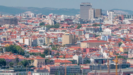 Fototapeta na wymiar Panorama of Lisbon historical centre aerial timelapse viewed from above the southern margin of the Tagus or Tejo River.