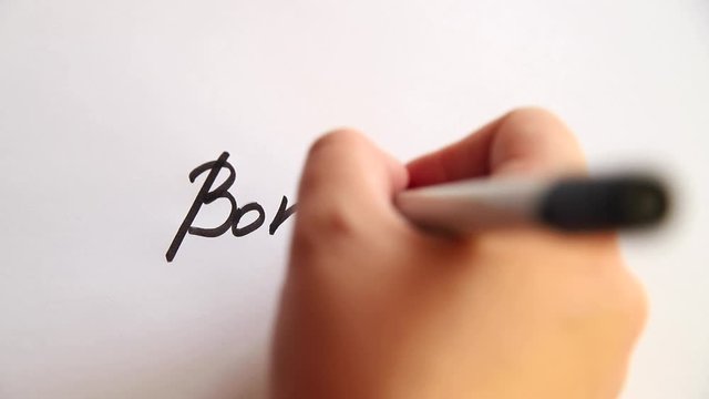 Hand writing Bonds down on white paper