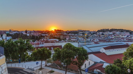 Obraz premium Sunrise over Lisbon aerial cityscape skyline timelapse from viewpoint of St. Peter of Alcantara, Portugal.