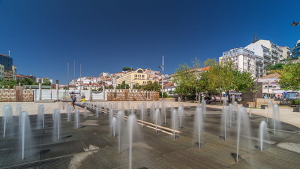 Fototapeta na wymiar Fountain in Martim Moniz square timelapse hyperlapse in downtown Lisbon