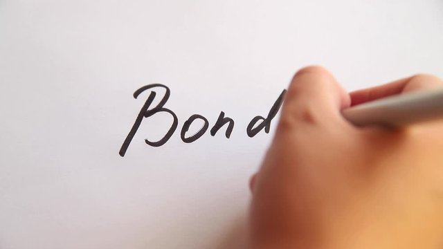 Hand writing Bonds on white paper