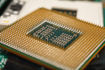 computer CPU close-up on the motherboard background, socket of central process unit, connection of  cpu with motherboard,  the structure of the processor chip, multi-core and multi-threading