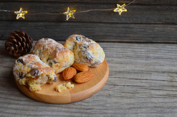 Traditional German,Swiss and Austrian Christmas pastry mini stollen cakes with dried fruit,nuts and spices on a rustic table.Winter festive baking concept.Selective focus.