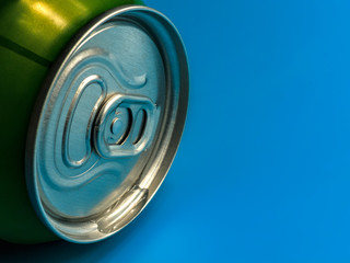 aluminum soda and beer beverage can with water droplets isolated on blue background, metal can, recyclable product