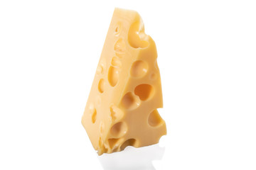 Piece of Swiss cheese isolated on white background