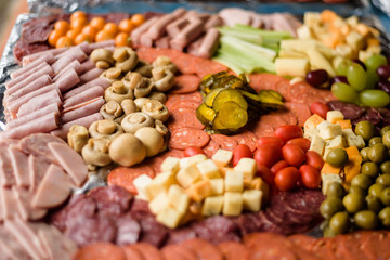 Mix of appetizer with cheese, ham and pickles 