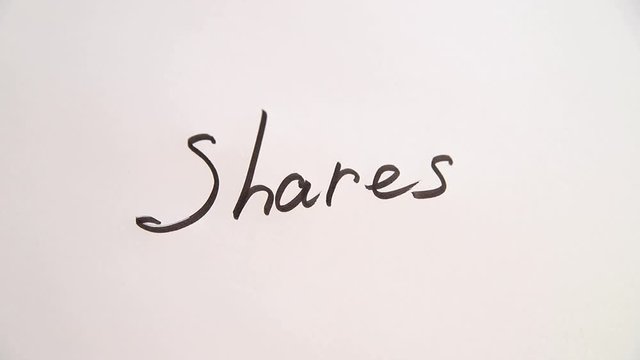 Hand writing Shares on white paper