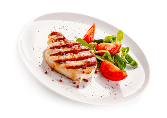 Grilled steak with vegetable salad on white background