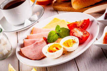 Continental breakfast on wooden table