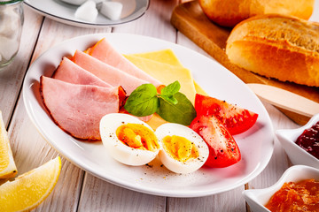 Continental breakfast on wooden table