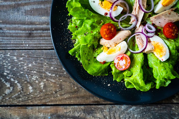Tuna salad on wooden table
