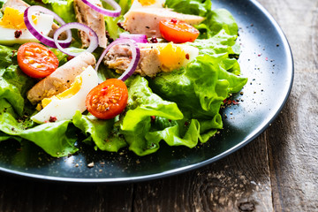 Tuna salad on wooden table