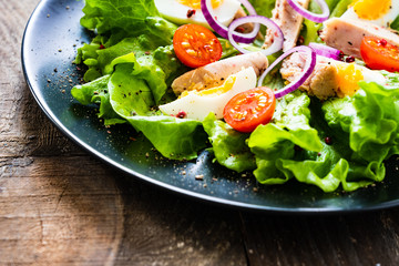 Tuna salad on wooden table