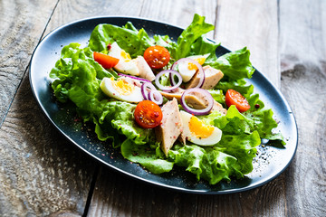 Tuna salad on wooden table
