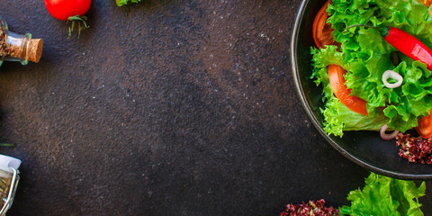 Healthy salad, leaves mix salad (mix micro greens, cucumber, tomato, chili pepper, other ingredients). food background. copy space