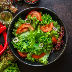 Healthy salad, leaves mix salad (mix micro greens, cucumber, tomato, chili pepper, other ingredients). food background. copy space