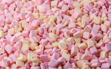 Many colorful fresh heart-shaped marshmallows. Texture, background
