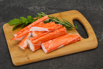 Crab stick surimi over board