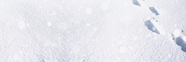 The texture of the snow. Winter rainfall. Tracks on a snowy road after a snowfall.