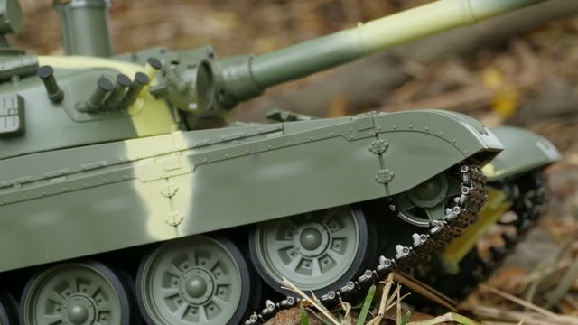 iron caterpillars of a battle tank in a combat position, camera in motion