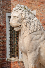 Ancient Venetian Piraeus lion head near Arsenal in Venice, Italy, closeup, details