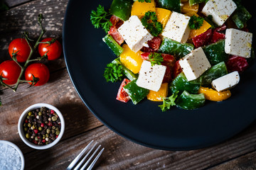  Fresh greek salad on wooden background