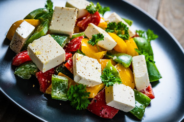  Fresh greek salad on wooden background