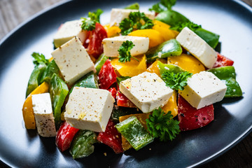  Fresh greek salad on wooden background