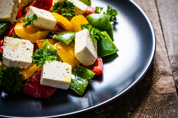  Fresh greek salad on wooden background