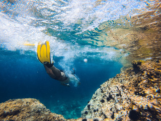 Men snorkeling by the reef