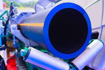 Production of large diameter pipes. The process of laying pipes. Gas pipe. Polyethylene pipe with a yellow stripe. Production of pipes for liquefied gas. Pipeline equipment. Gas from Russia