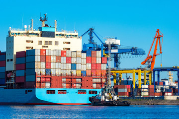 Helsinki. Finland. Barge with sea containers. Freight ferry at loading in Helsinki. Transportation...