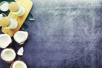 Coconut on a dark stone table. Coconut oil.