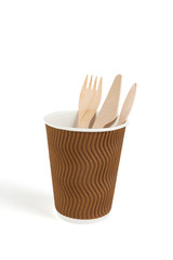 Eco - friendly  fork, spoon, knife and cup isolated on white background . Disposable tableware.