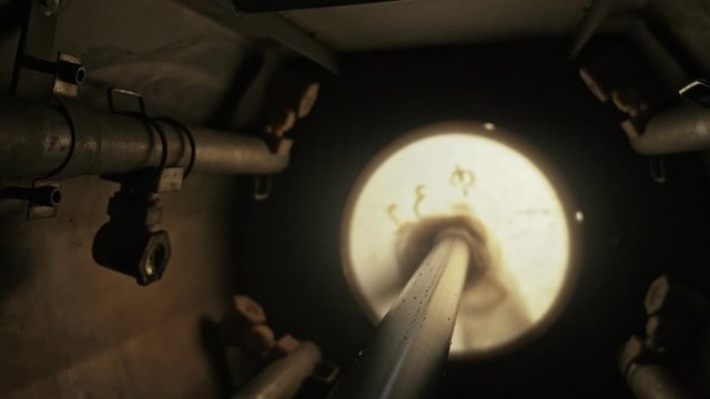 Pipes manufacturing production line. Manufacture of plastic water pipes of the factory. Process of making plastic tubes on the machine tool with the use of water and air pressure.