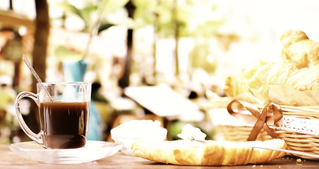 Fresh pastries on the table. French flavored croissant and coffee.