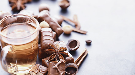 Chocolate bars on a black background in backlight. Chocolate with filling. Sweet sweets for snack and tea.