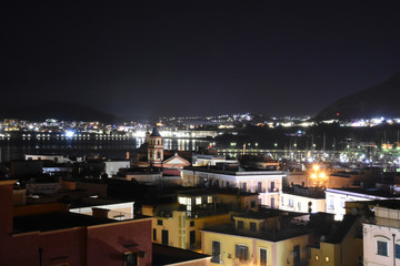 Fototapeta na wymiar Night view of the town of Pozzuoli, Italy