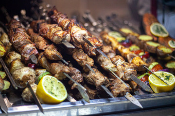 Georgian kebab. Tasty meat fried on skewers. A lot of meat cooked according to the Caucasian recipe. The work of the chef. Folk dish. Cooked over an open fire.