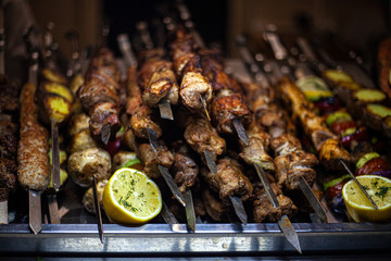 Georgian kebab. Tasty meat fried on skewers. A lot of meat cooked according to the Caucasian recipe. The work of the chef. Folk dish. Cooked over an open fire.
