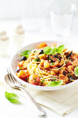 Spaghetti pasta with vegetable sauce. Bright background
