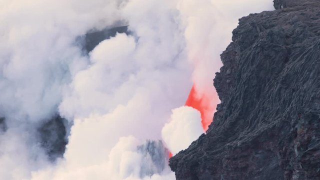 Lava from the Kīlauea volcano flows into the ocean on the Big Island of Hawaii