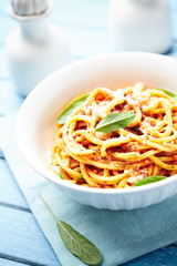 Spaghetti pasta in a small bowl. Bright background