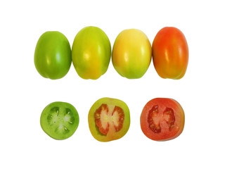 Colorful unripe tomatoes, green, yellow and red, whole and slices, set isolated on white background top view