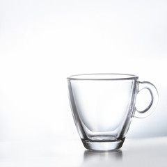 Empty transparent double wall glass tea or coffee mug isolated on white background. Your text here