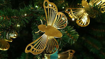 Christmas decorations on the Christmas tree. Butterfly.