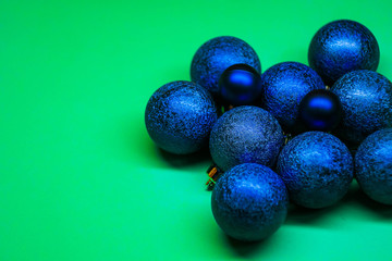 Classic blue Christmas balls isolated on mint background