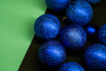 Christmas balls on multicolored background. New Year wallpaper 