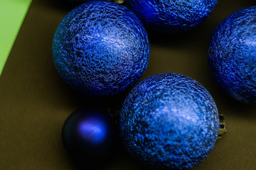 Christmas balls on multicolored background. New Year wallpaper 