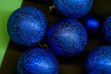 Christmas balls on multicolored background. New Year wallpaper 